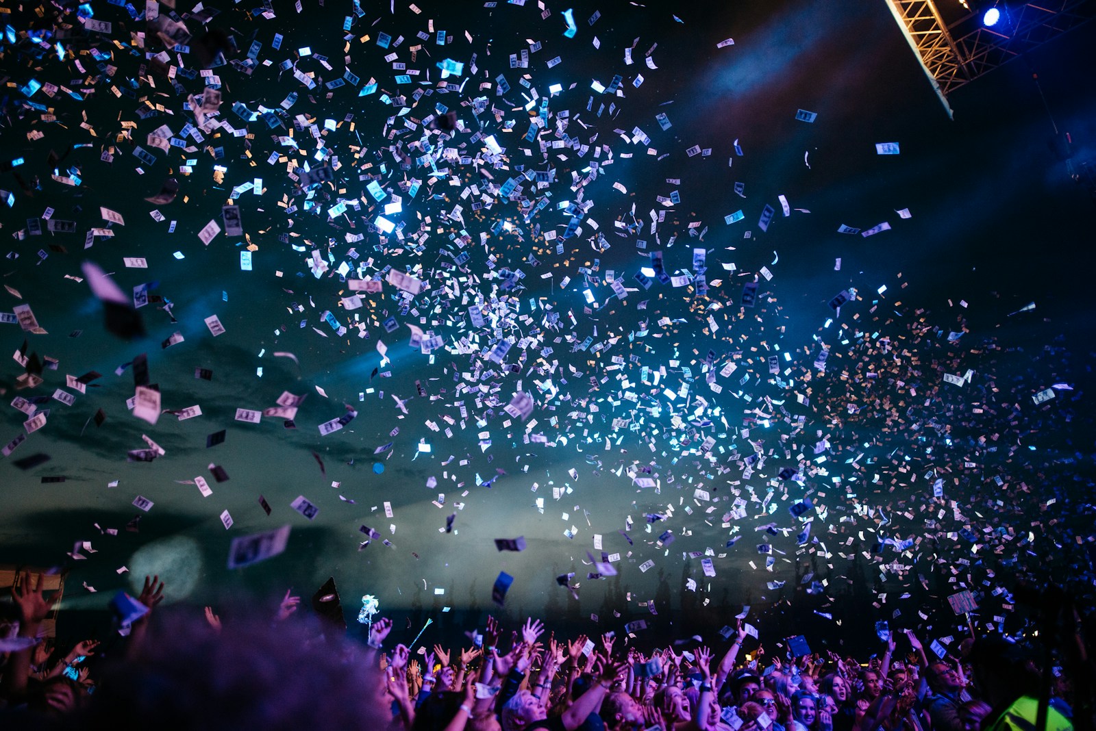 Confetti filling the air above a live concert crowd
