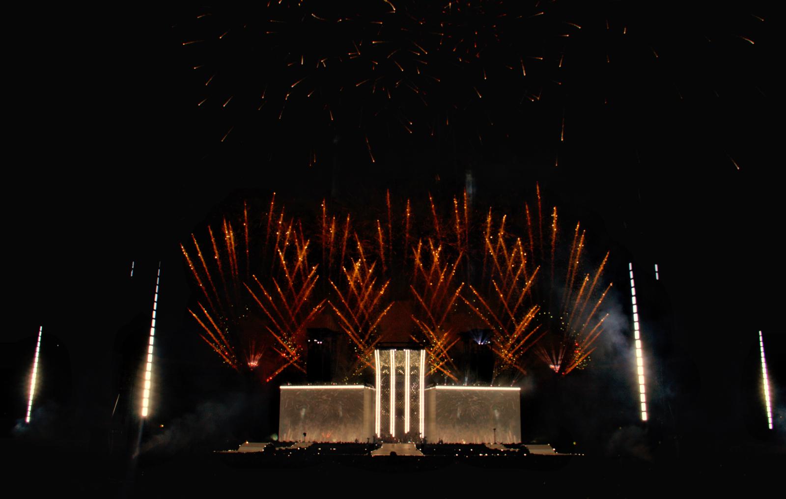 Stadium stage surrounded by precision pyrotechnics